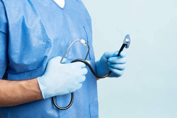 Young Male Doctor Blue Medical Scrubs Nitrile Gloves Holding His — Fotografia de Stock