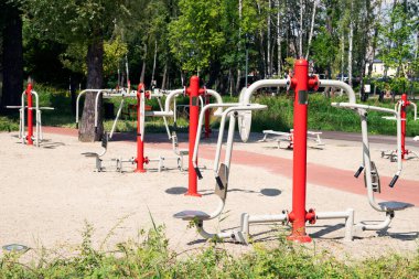 Outdoor gym in the middle of urban park. Free entrance for 
