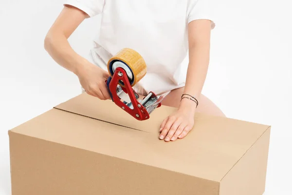 Woman preparing online shopping parcel for shipping. Online 