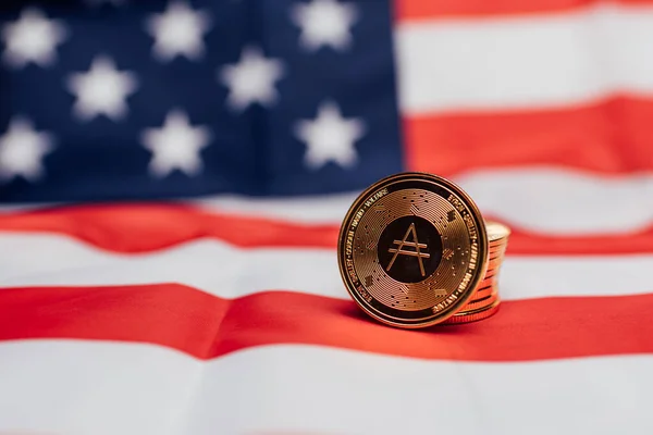 Cardano ADA cryptocurrency coin with the United States flag.