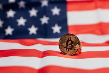 Bitcoin cryptocurrency coins with the flag of the United States.