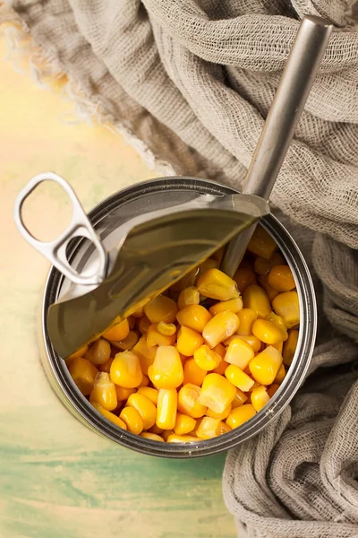 Open tin can, with corn, top view, selective focus, no people, close-up,