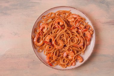 Spaghetti with king shrimps , with spices, top view, selective focus, homemade, no people,