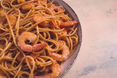 Spaghetti with king shrimps , with spices, top view, selective focus, homemade, no people,