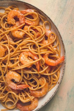 Spaghetti with king shrimps , with spices, top view, selective focus, homemade, no people,