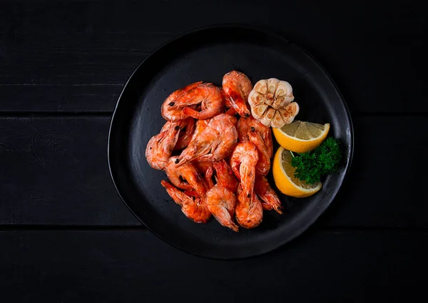 Fried shrimp, on a black background, top view, no people,