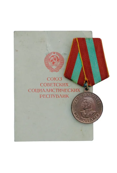 The medal USSR "For valorous work in the Great Patriotic War of 1941-1945" with the certificate. The isolated image. — Stock Photo, Image