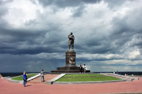 Monument to Valery Chkalov in Nizhny Novgorod, against the storm sky