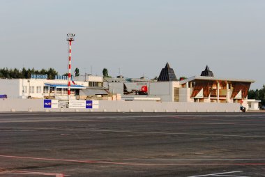 The air terminal building at Strigino's airport in Nizhny Novgorod. View from the party of a take-off field. clipart