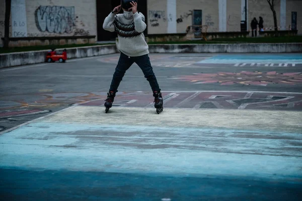 Caucasian boy practises roller skating in a city park — ストック写真