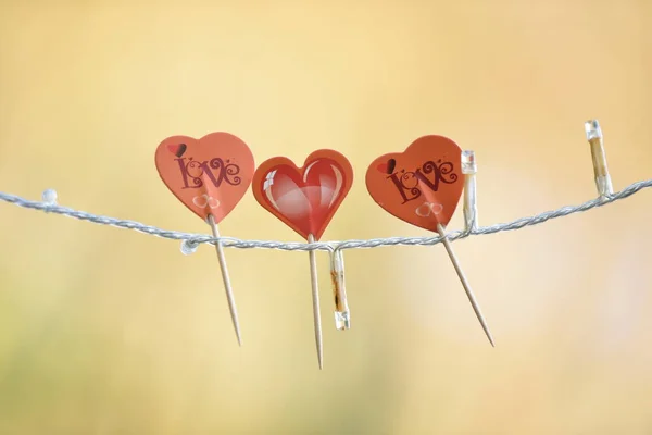 Alla hjärtans dag prydnad tre röda hjärtan med olika design — Stockfoto