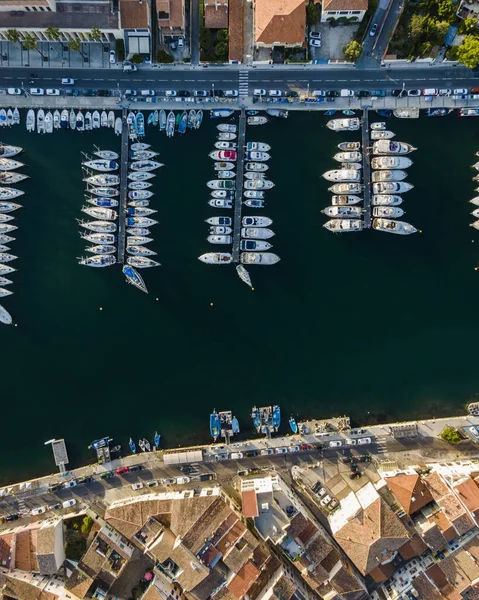 Aerial view of sailing boats anchored along the river in Martigues canal, Provence, France.