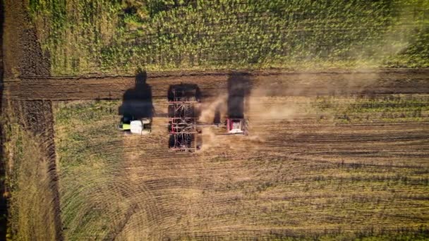 Tractor sowing seed onto field. Planting equipment and implements — Αρχείο Βίντεο