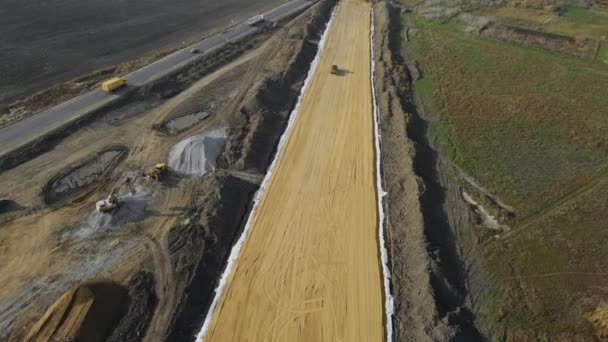 Construction of new road next to old worn-out highway — Video Stock