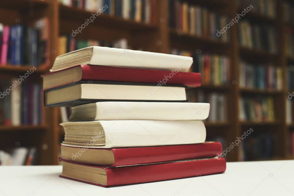  Stack of books on the table in library