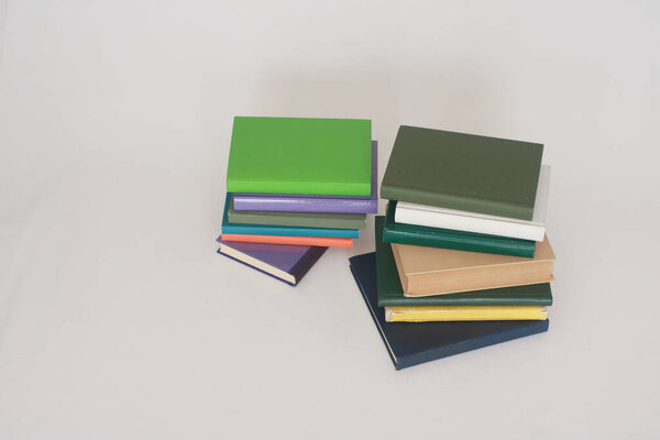 Stack of school books on white badkground