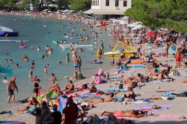 Makarska, Croatia, 03.08.2022Tourists from European countries enjoy their holidays by the sea and the beach in Makarska, a tourist resort in the south of Croatia