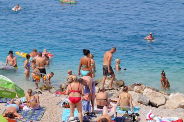 Makarska, Croatia, 11.08.2022.Tourists on the beach in Makarska in August, when Croatia records a record number of guests vacationing in Croatian tourist destinations