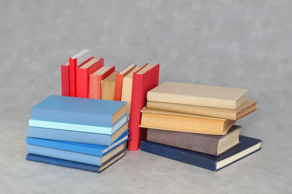 books and pile of book on grey background