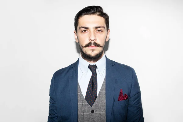 Front image of a man in suit. Male beard and mustache. Elegant handsome man in suit. Handsome bearded businessman in classic suits.