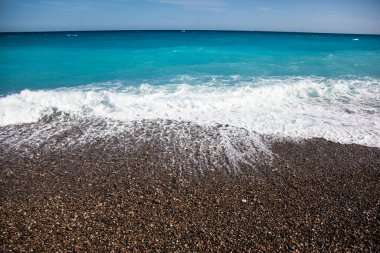 Top view of beautiful white sand beach with turquoise blue ocean water.