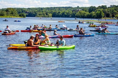 Wausau, Wisconsin, USA, July, 30, 2022: 8th Annual Paddle Pub Crawl on Lake Wausau and the Wisconsin River, Kayakers enjoy the Saturdays event with beautiful weather, horizontal