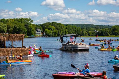 Wausau, Wisconsin, USA, July, 30, 2022: 8th Annual Paddle Pub Crawl on Lake Wausau and the Wisconsin River, Kayakers enjoy the Saturdays event with beautiful weather, horizontal