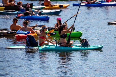 Wausau, Wisconsin, USA, July, 30, 2022: 8th Annual Paddle Pub Crawl on Lake Wausau and the Wisconsin River, Kayakers enjoy the Saturdays event with beautiful weather, horizontal