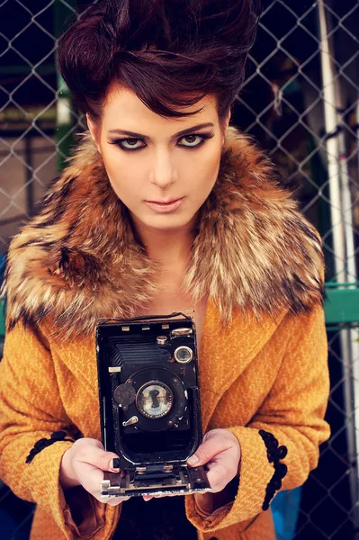 Girl with retro camera — Stock Photo, Image
