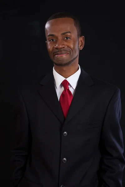 Happy Black businessman with a smile in a suit