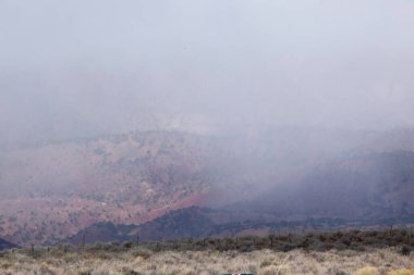 Clouds on distant mountains