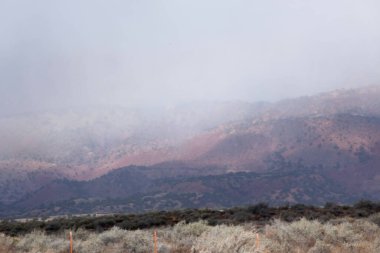 Clouds on distant mountains