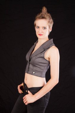 Pretty woman with her hands on her hips and a smile