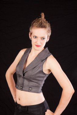 Pretty woman with her hands on her hips and a smile