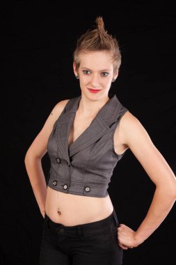 Pretty woman with her hands on her hips and a smile