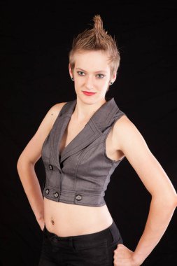 Pretty woman with her hands on her hips and a smile