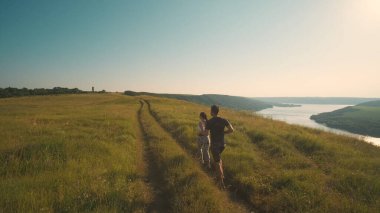 The man and woman running on a beautiful river background