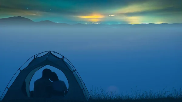 Man Woman Sitting Camp Tent Night City Background – stockfoto