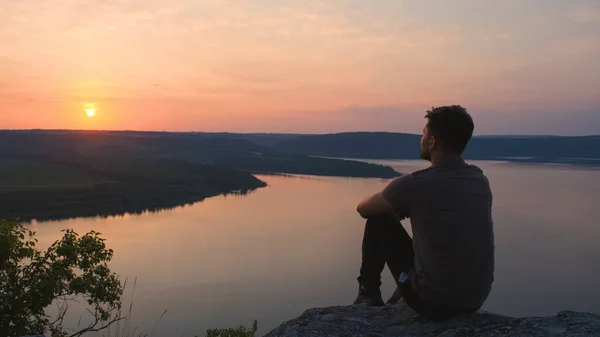 Young Man Sitting Rocky Mountain Beautiful River — kuvapankkivalokuva