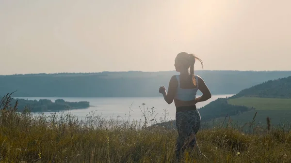 Beautiful Woman Jogging Picturesque Background – stockfoto