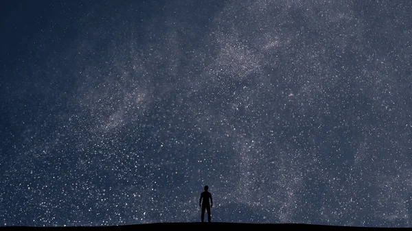 The man stands on a picturesque starry sky background