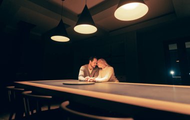 The man and woman dating at the empty night bar