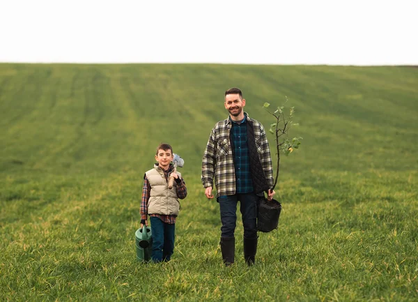 Father Little Son Gardening Field – stockfoto