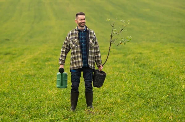 Yound Gardener Going Plant Tree Field — kuvapankkivalokuva