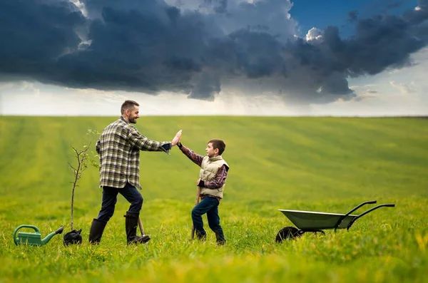 Young Man His Son Have Fun Field – stockfoto
