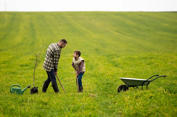 Young Man His Son Have Fun Field – stockfoto