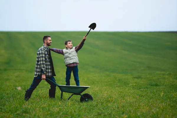 Young Farmer His Son Have Fun Field – stockfoto