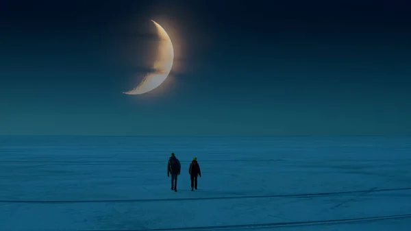 The two travelers walking through the snow field on the moonlight sky background