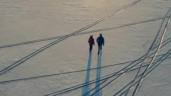 Upper View Two Explorers Going Snow Field — kuvapankkivalokuva