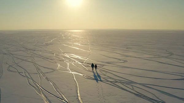 Upper View Two Tourists Trekking Icy Field — kuvapankkivalokuva